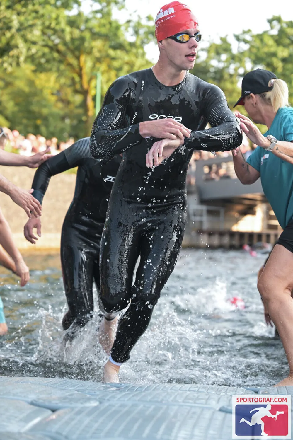 Danny Verdel running out of the water after the swim at Ironman 70.3 Duisburg 2026