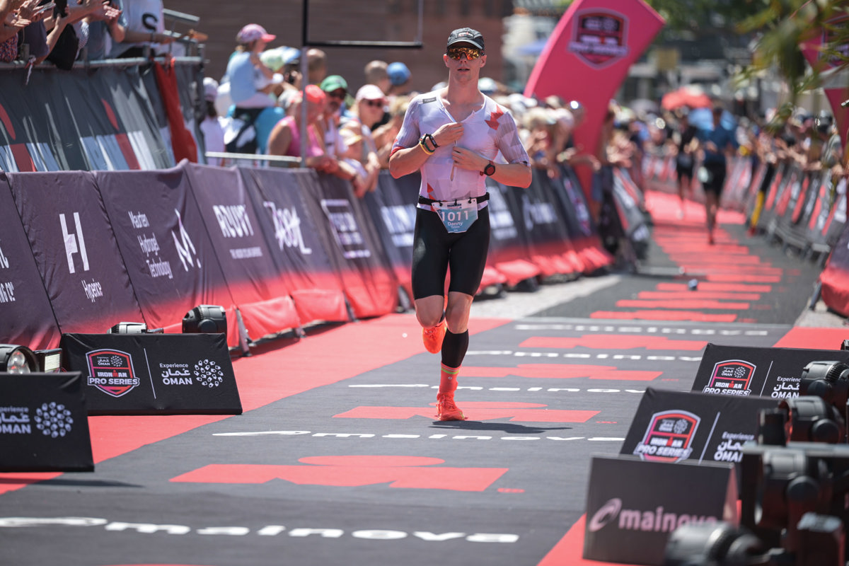 Hero image of website seeing Danny run down the finish line at Ironman Frankfurt