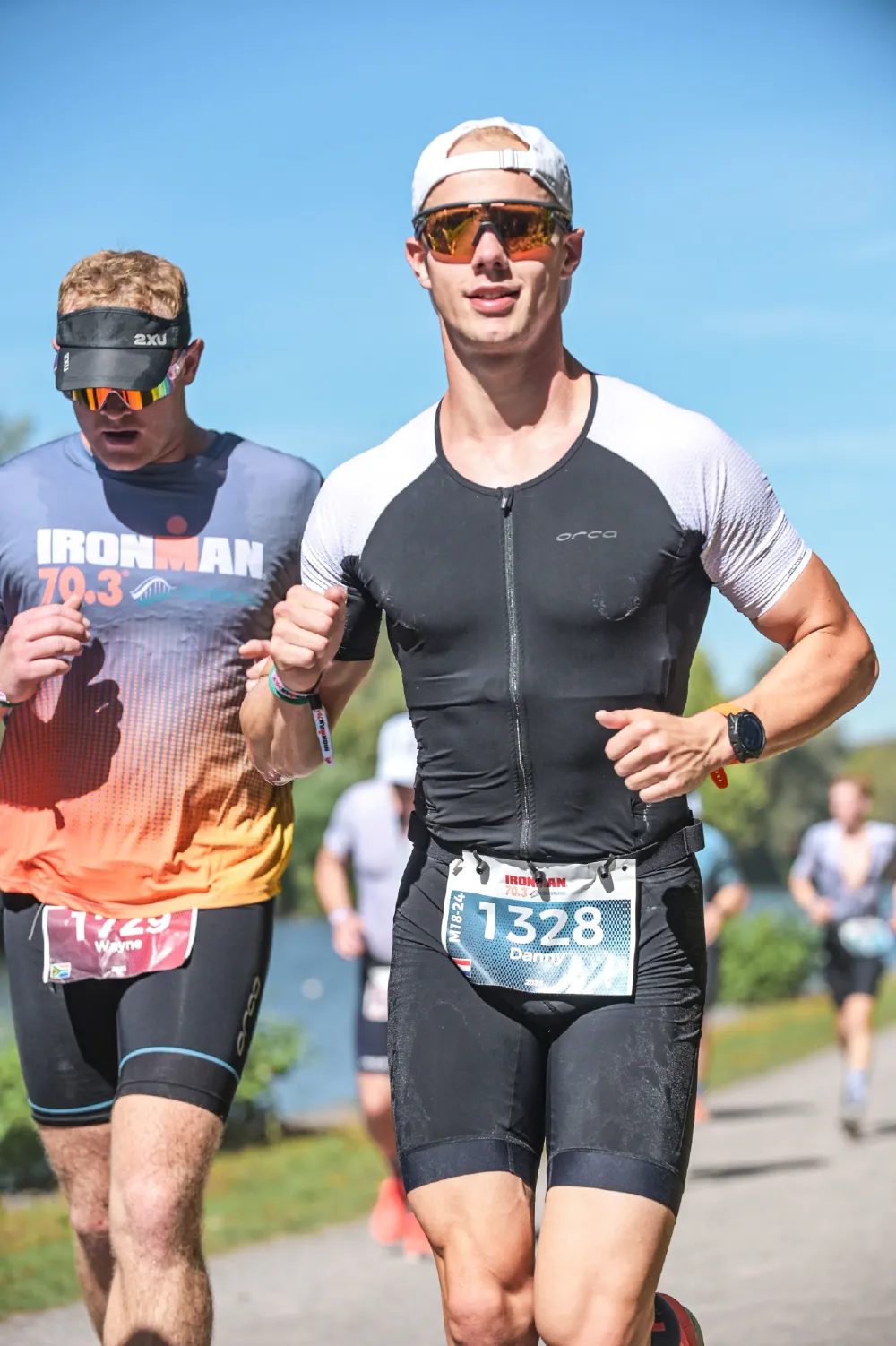 Danny Verdel running alongside another athlete during the run of Ironman 70.3 Duisburg 2025