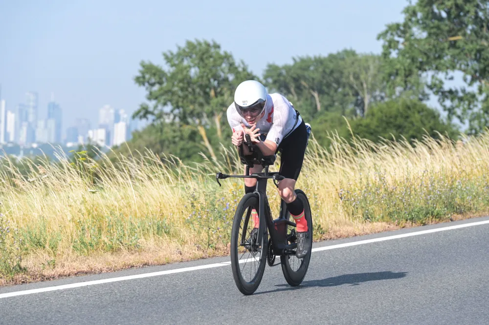Danny Verdel in aero position with the Frankfurt skyline in the distance, Ironman Frankfurt 2026