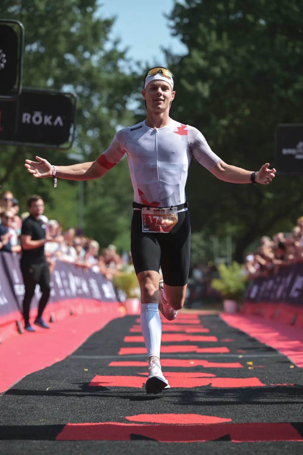 Danny Verdel spreading both arms just before the finish line of Ironman 70.3 Duisburg 2026