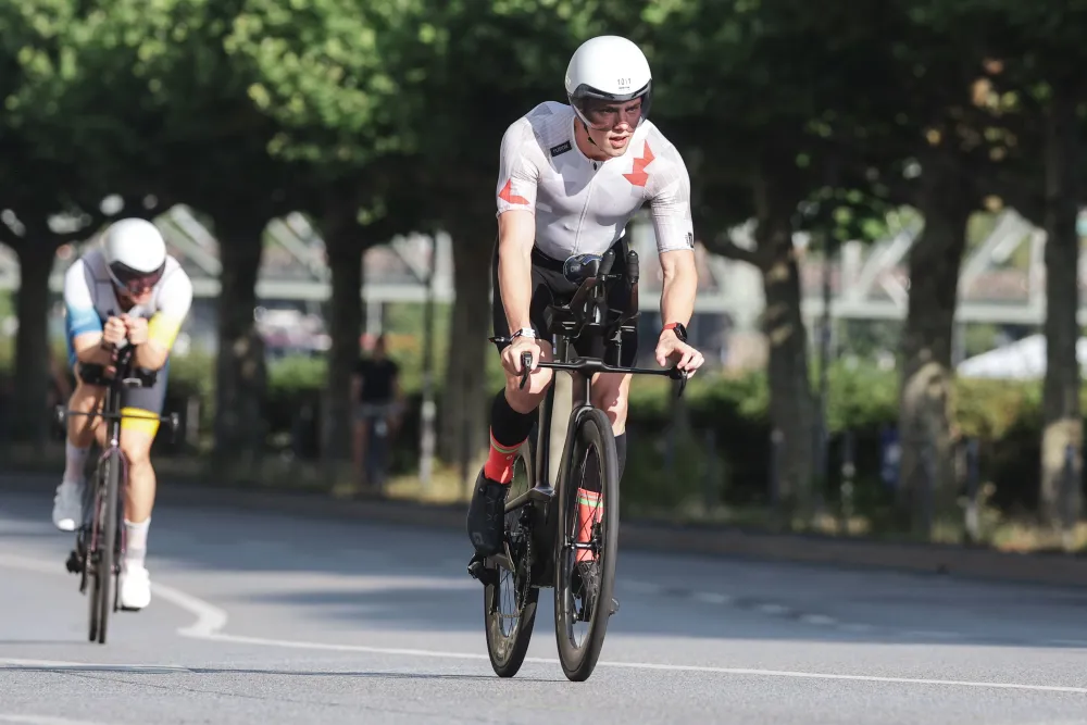 Danny Verdel on the bike with another athlete behind during Ironman Frankfurt 2026