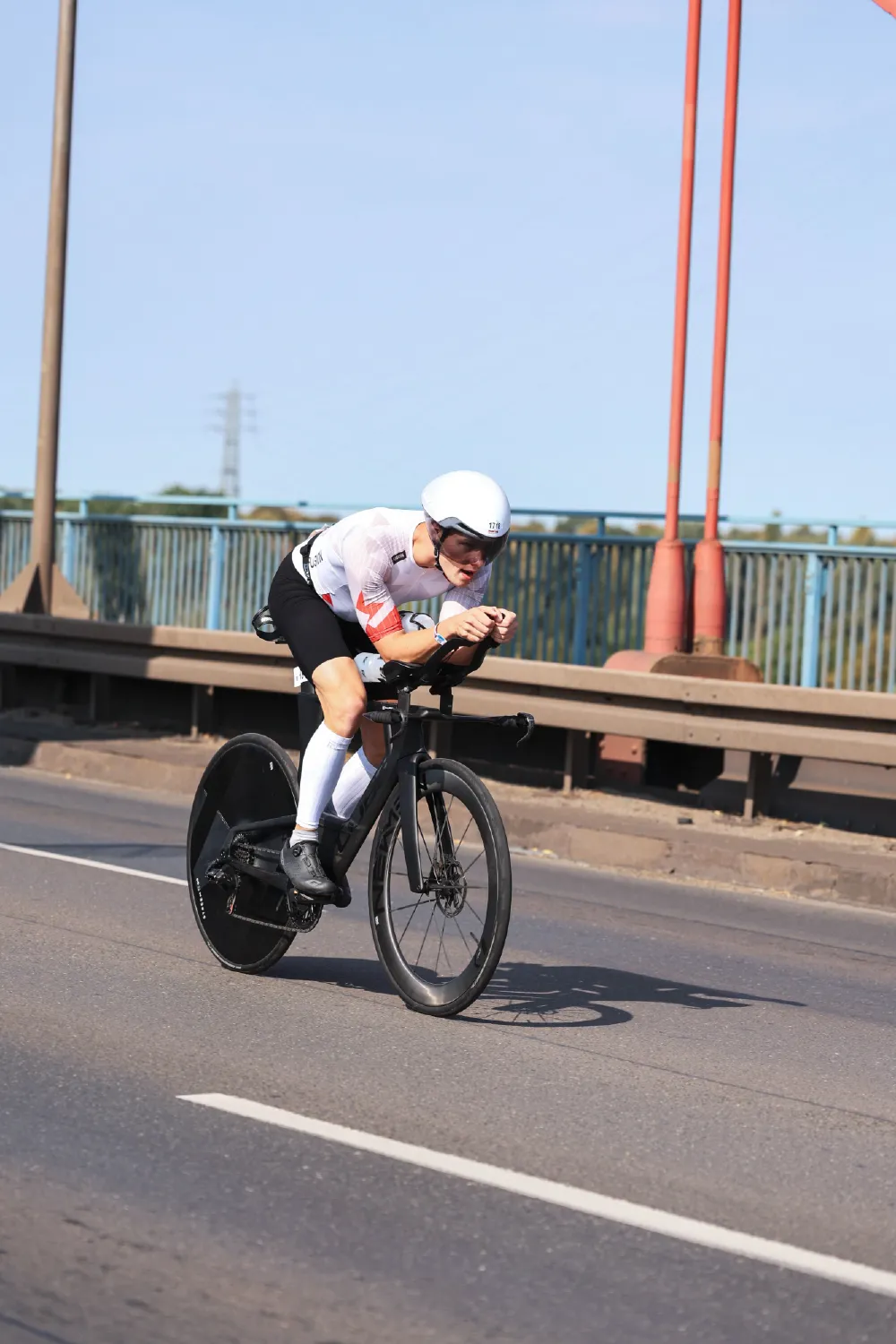 Danny Verdel in aero position on a bridge during the bike leg of Ironman 70.3 Duisburg 2026