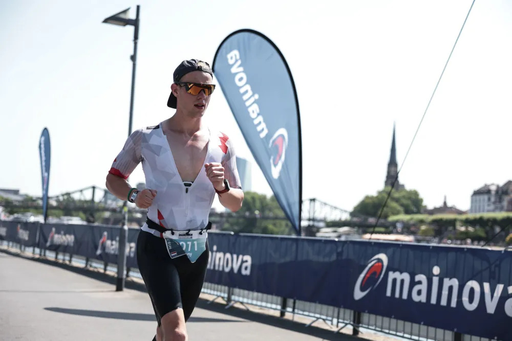 Danny Verdel running along the river Main during Ironman Frankfurt 2026