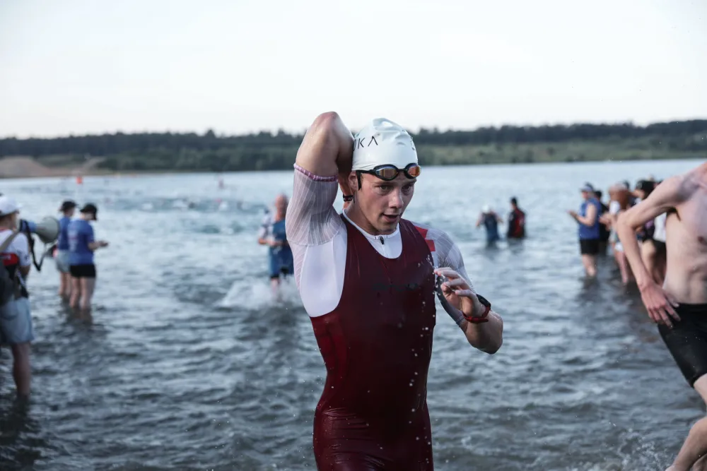 Danny Verdel wading out of the lake after the swim at Ironman Frankfurt 2026