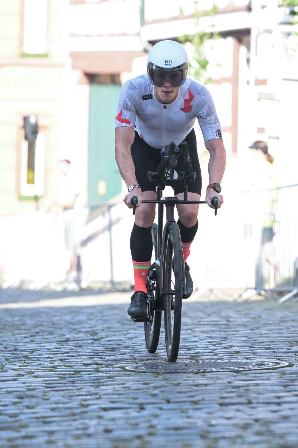 Danny Verdel riding over cobblestones during the bike leg of Ironman Frankfurt 2026